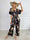 Pams Fly Jumpsuit - Elastisk byxdress med blommor- och fågelmönster