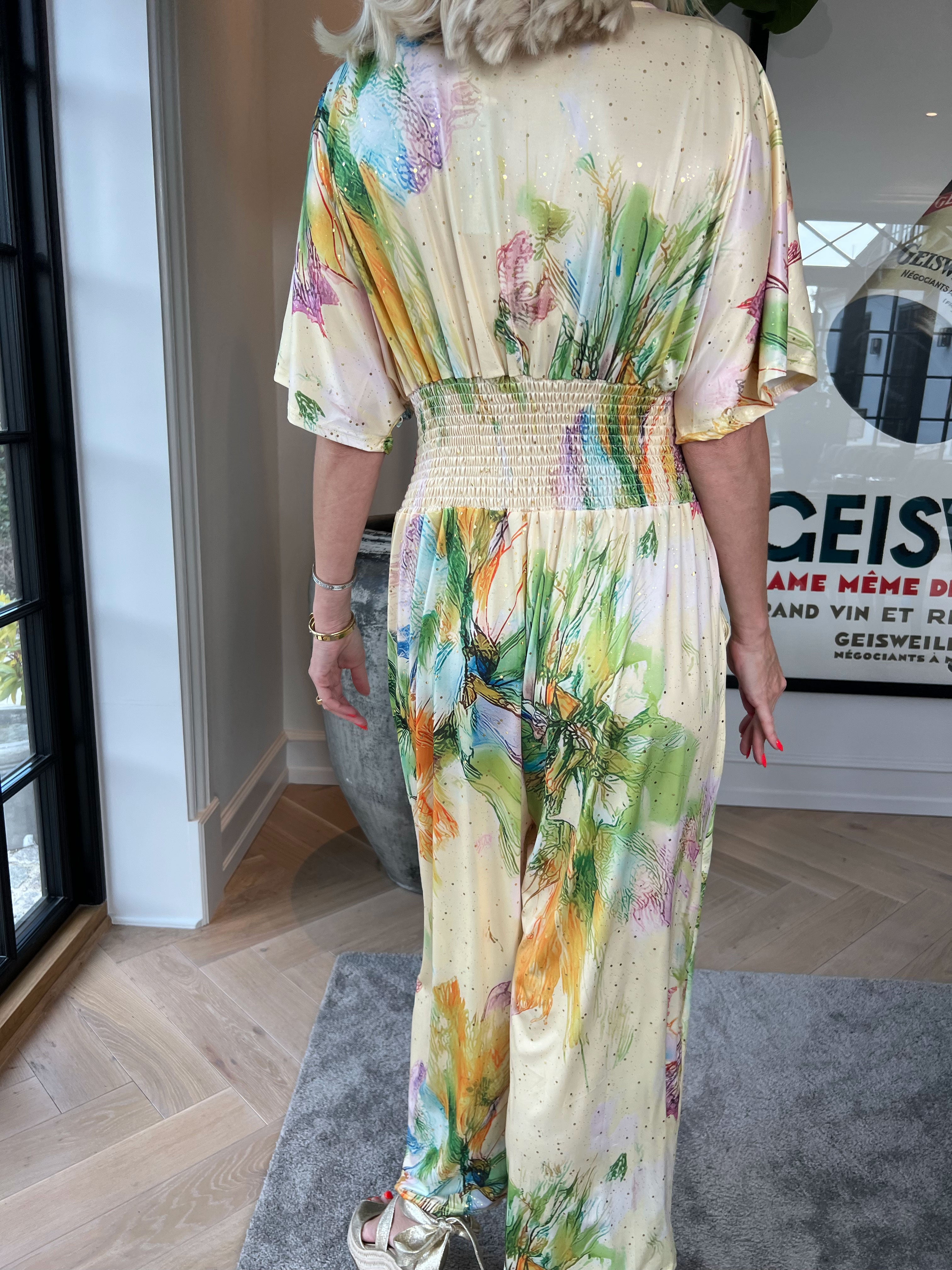 Pams Print Jumpsuit - Stretchig mönstrad jumpsuit med guldfärgat damm