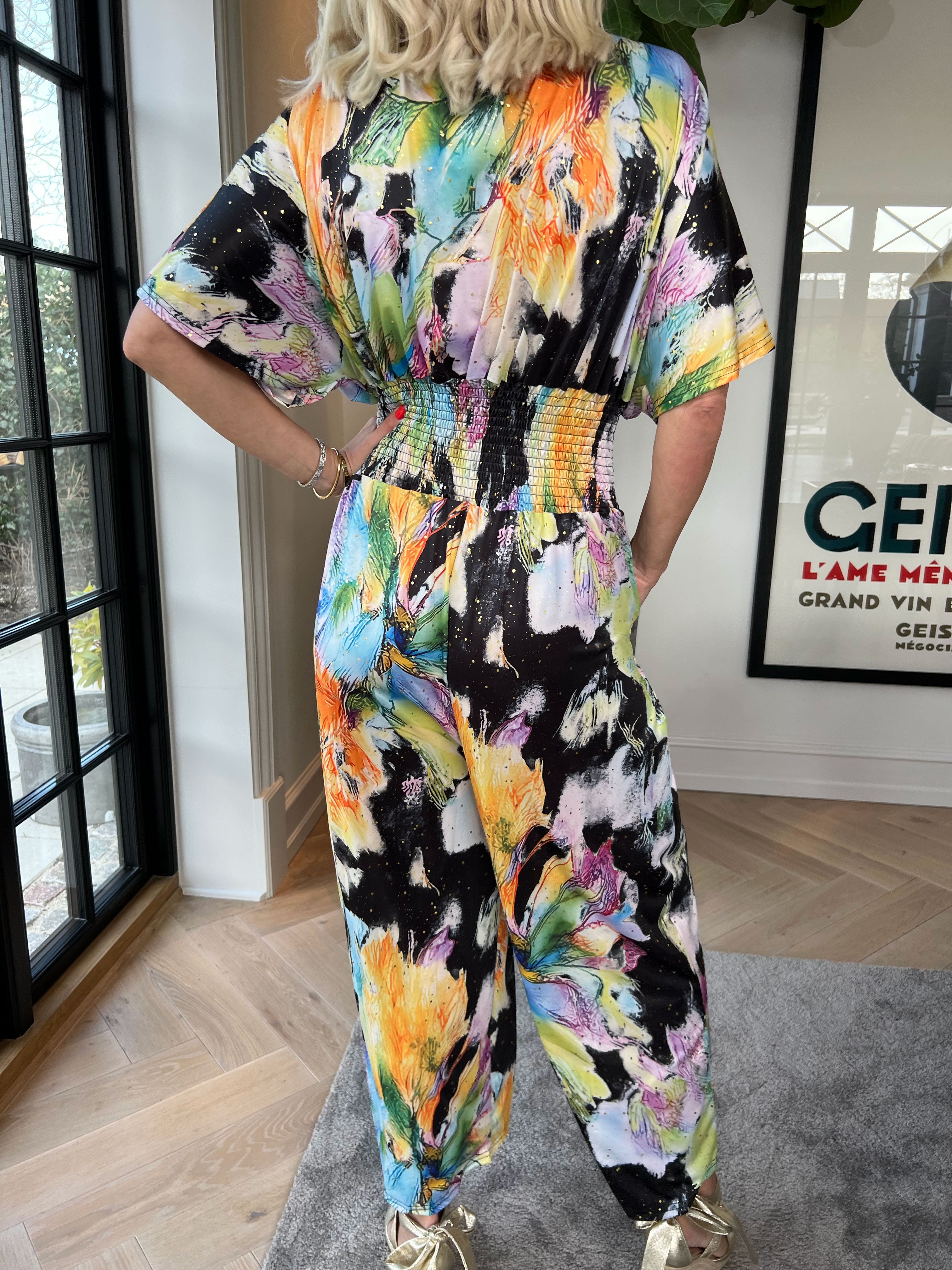 Pams Print Jumpsuit - Stretchig mönstrad jumpsuit med guldfärgat damm