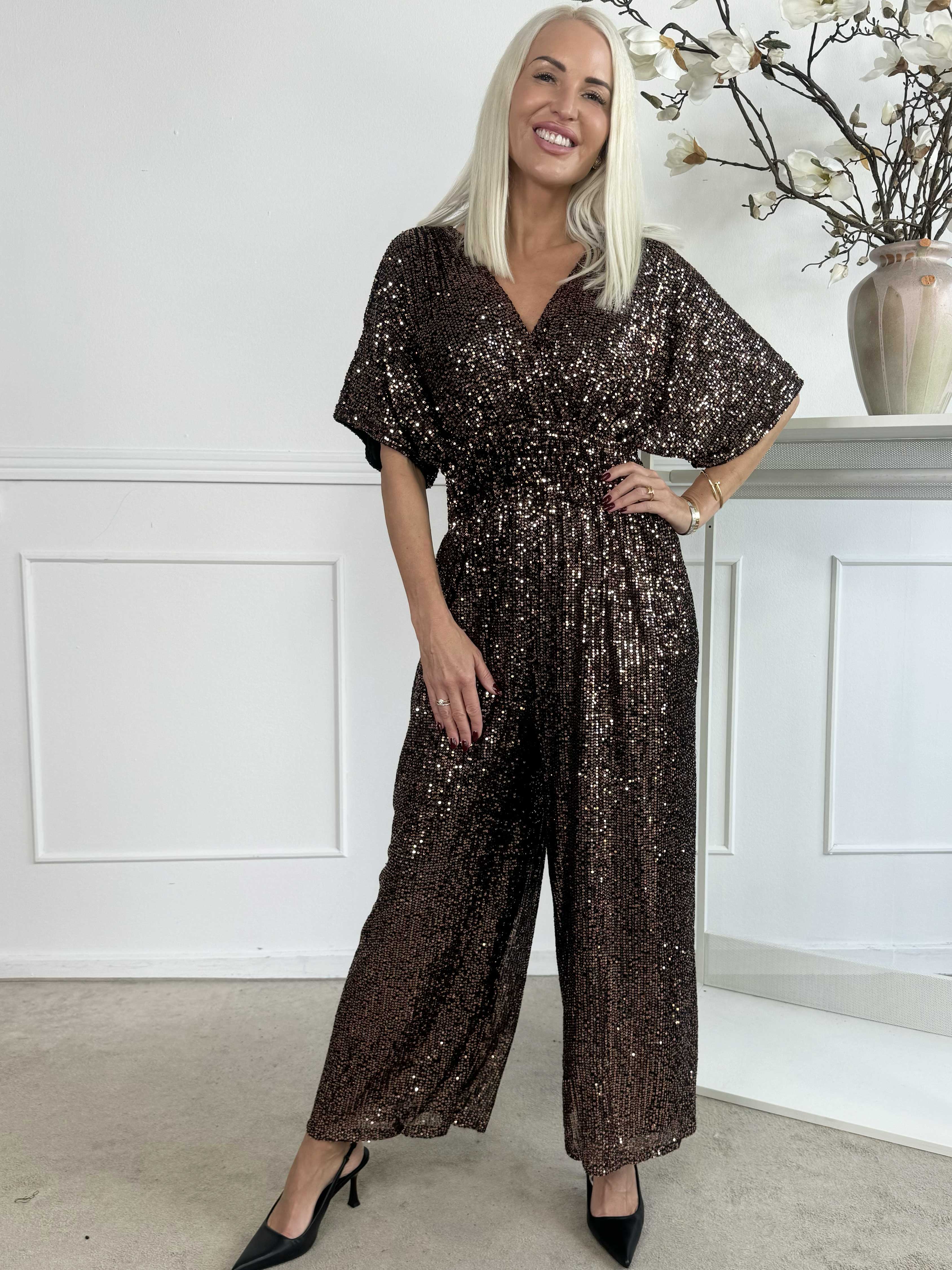 Pams Glitter Jumpsuit - Elastisk jumpsuit med smock och paljetter