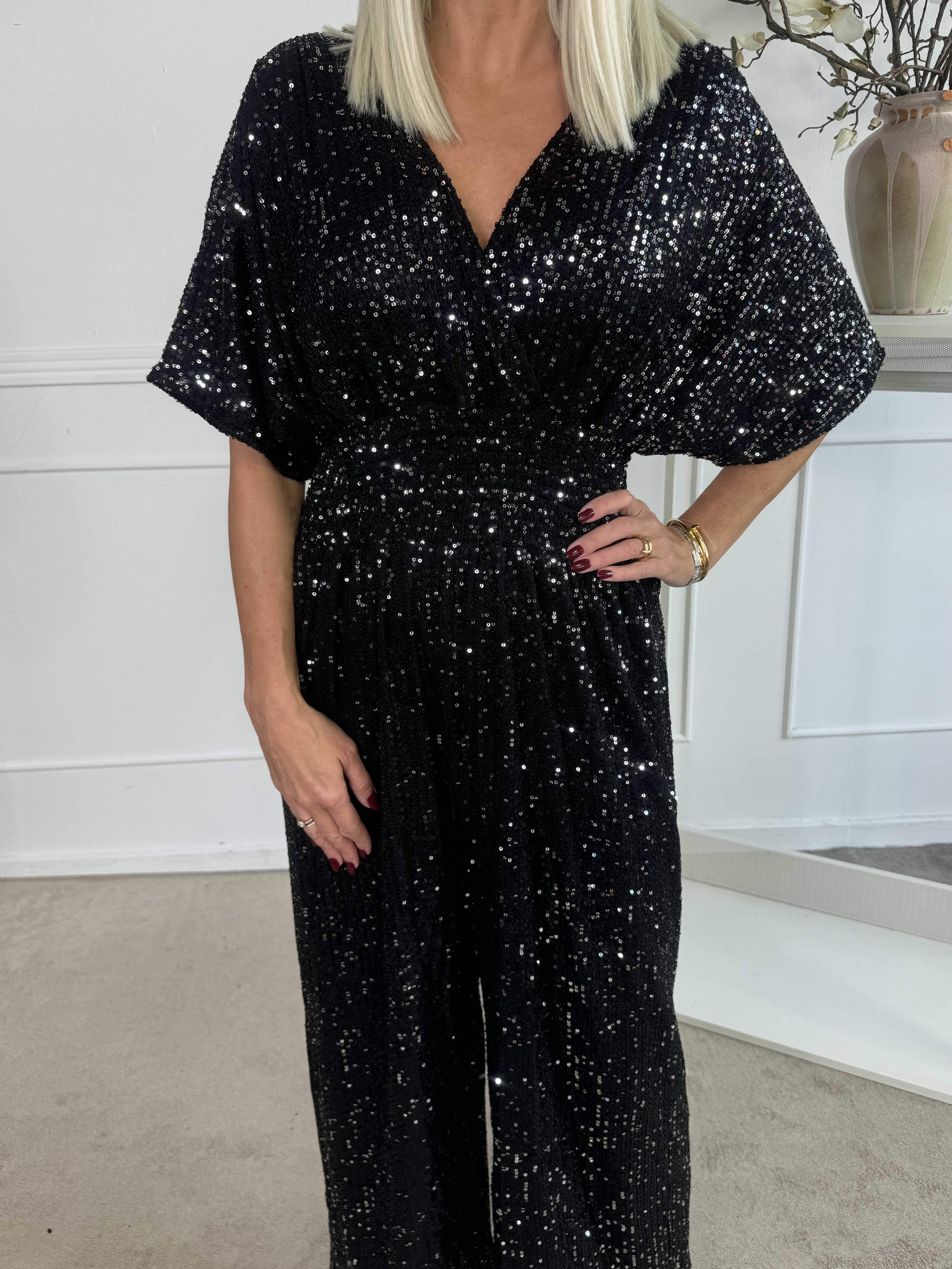 Pams Glitter Jumpsuit - Elastisk jumpsuit med smock och paljetter