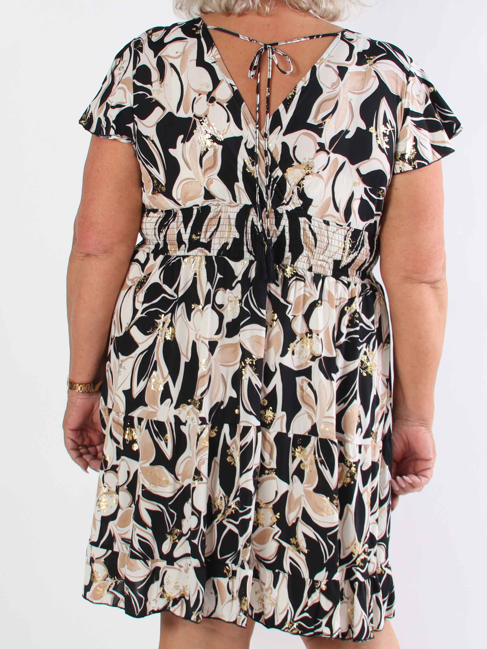 Palmira - Mönstrad elastisk plus size klänning med lager på lager look
