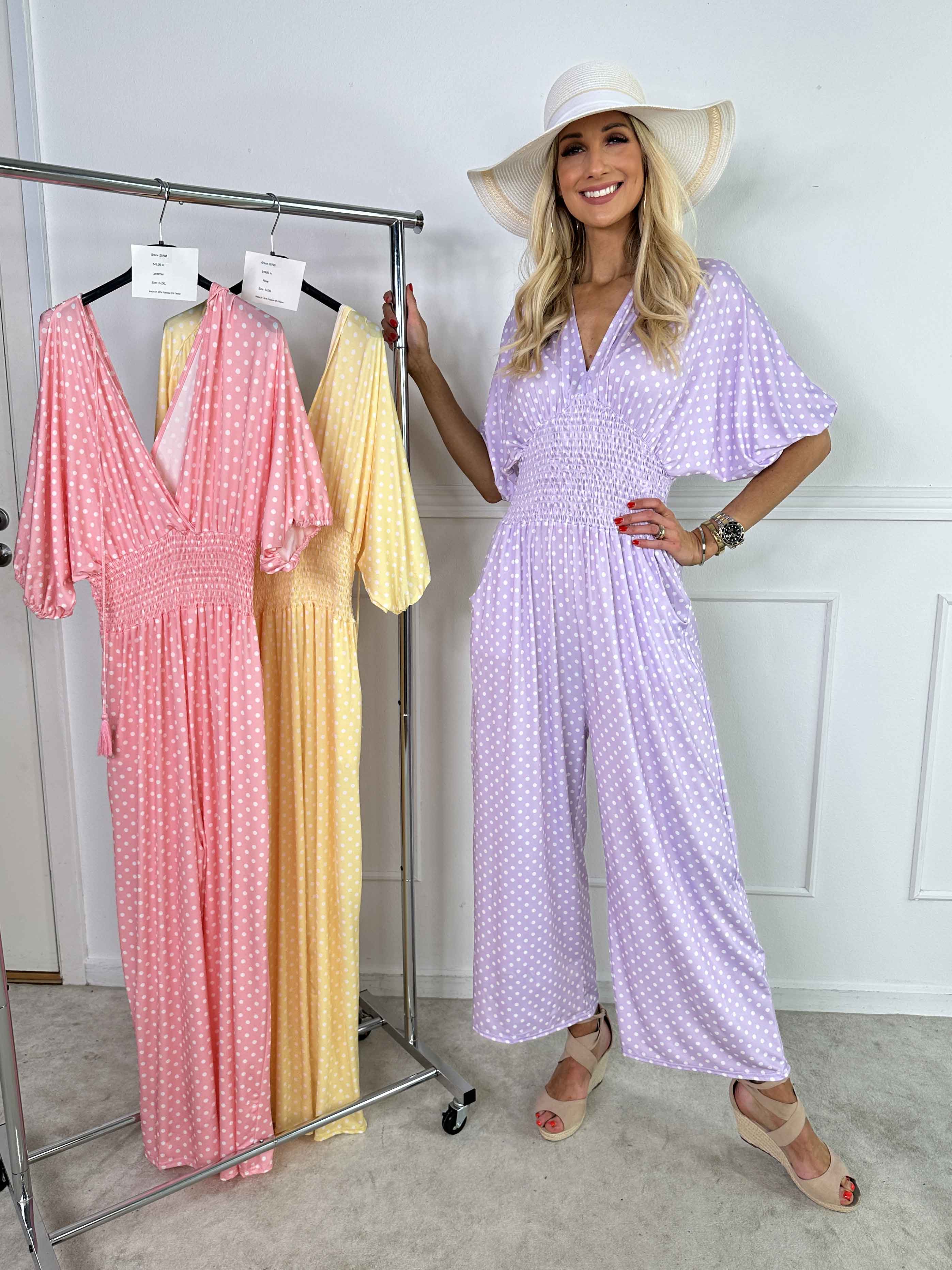 Grace - Stretchig jumpsuit med vita prickar