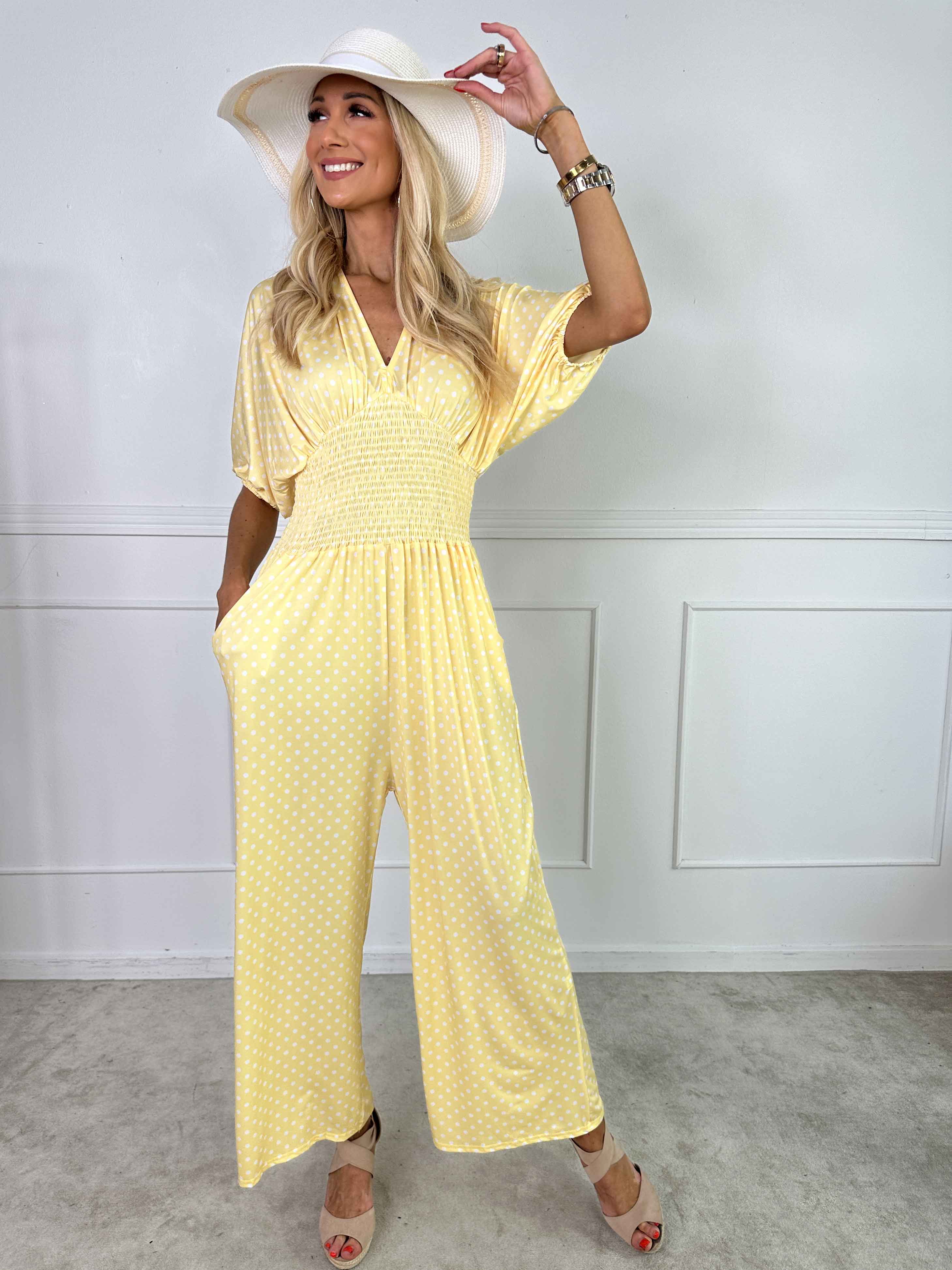 Grace - Stretchig jumpsuit med vita prickar