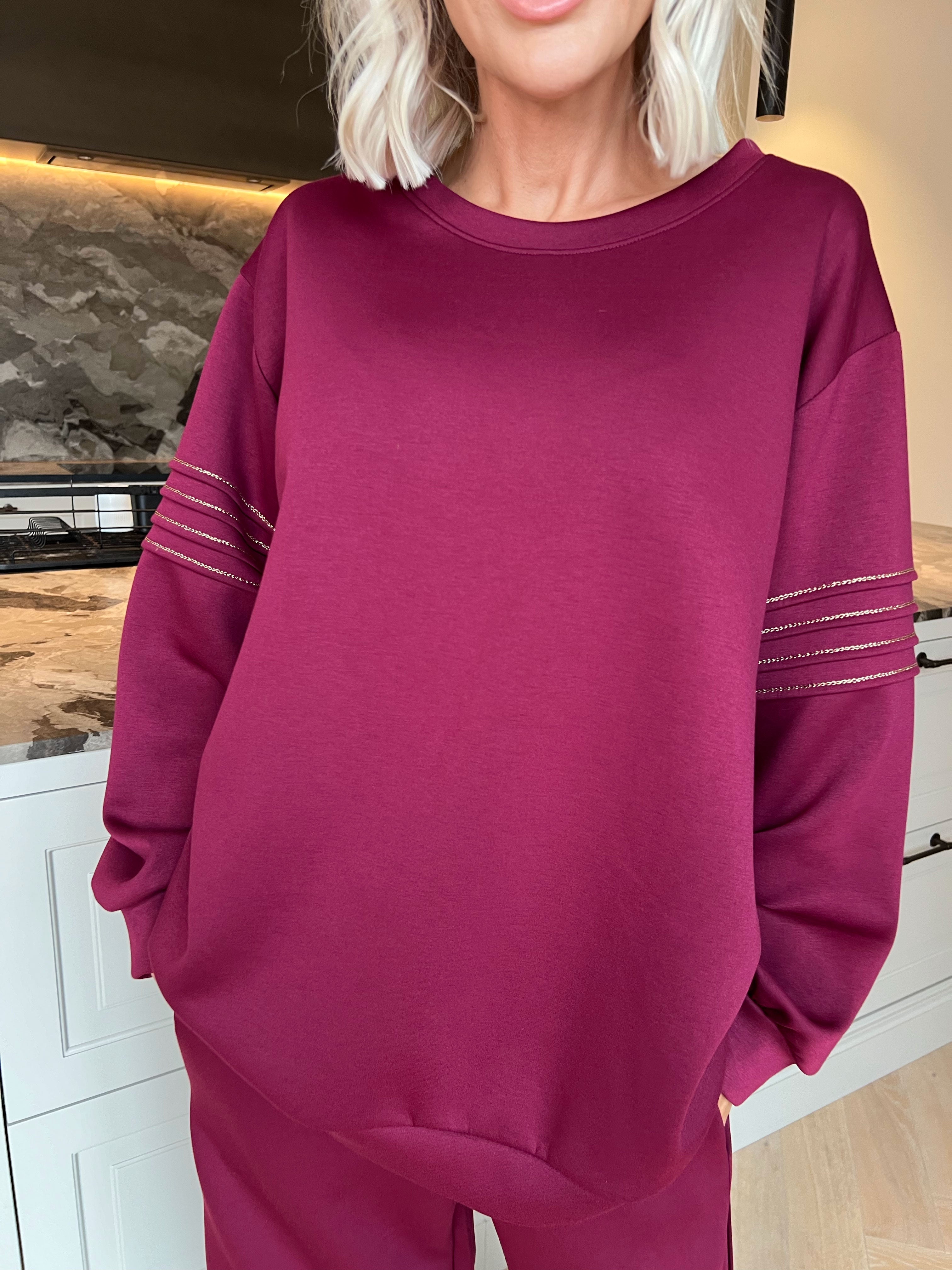 Dream – Mjukt träningsoverallset i viskos med eleganta gulddetaljer