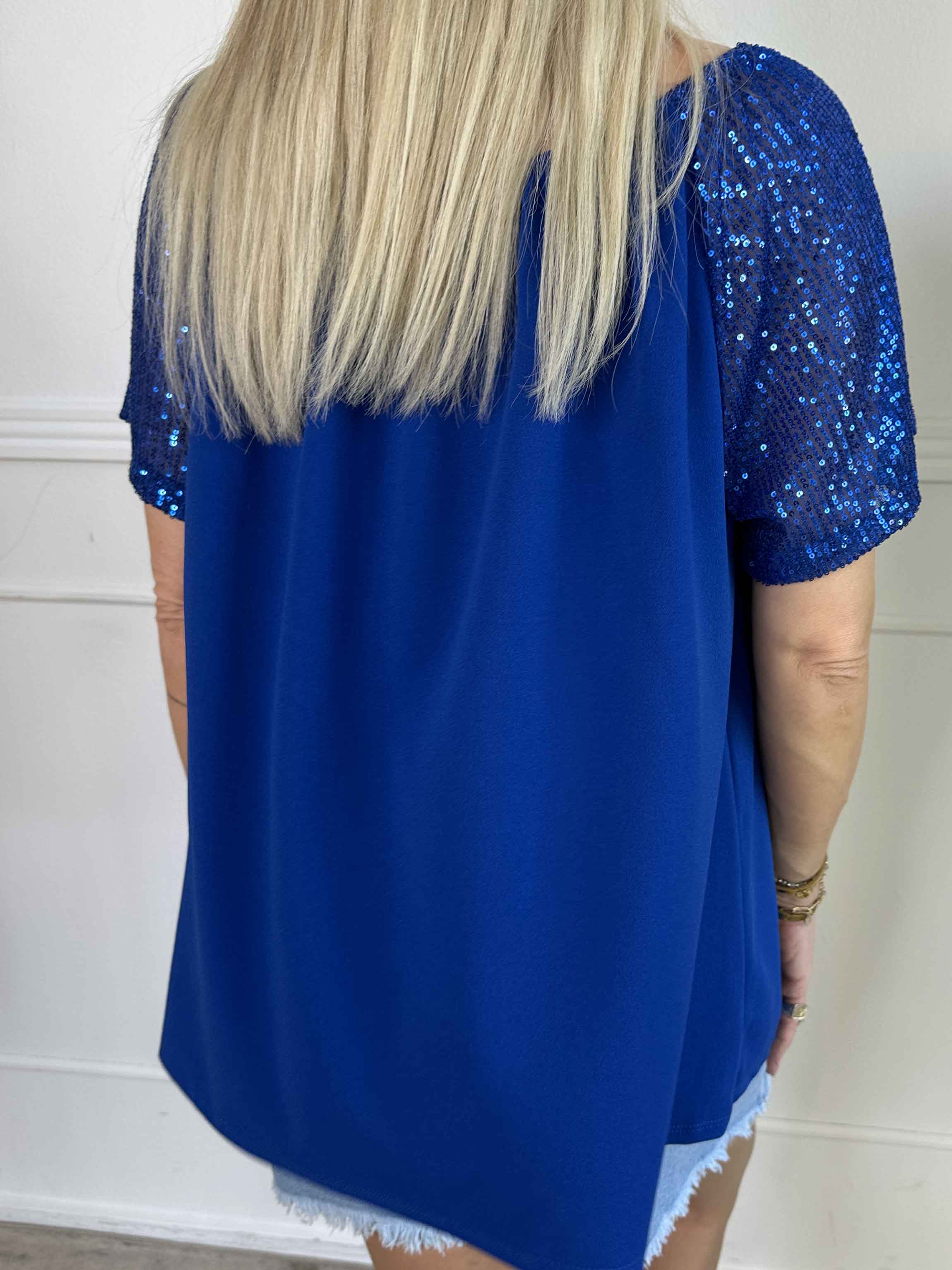 Kim Shirt - Söt och feminin blus med resår och ärmar med glittriga paljetter