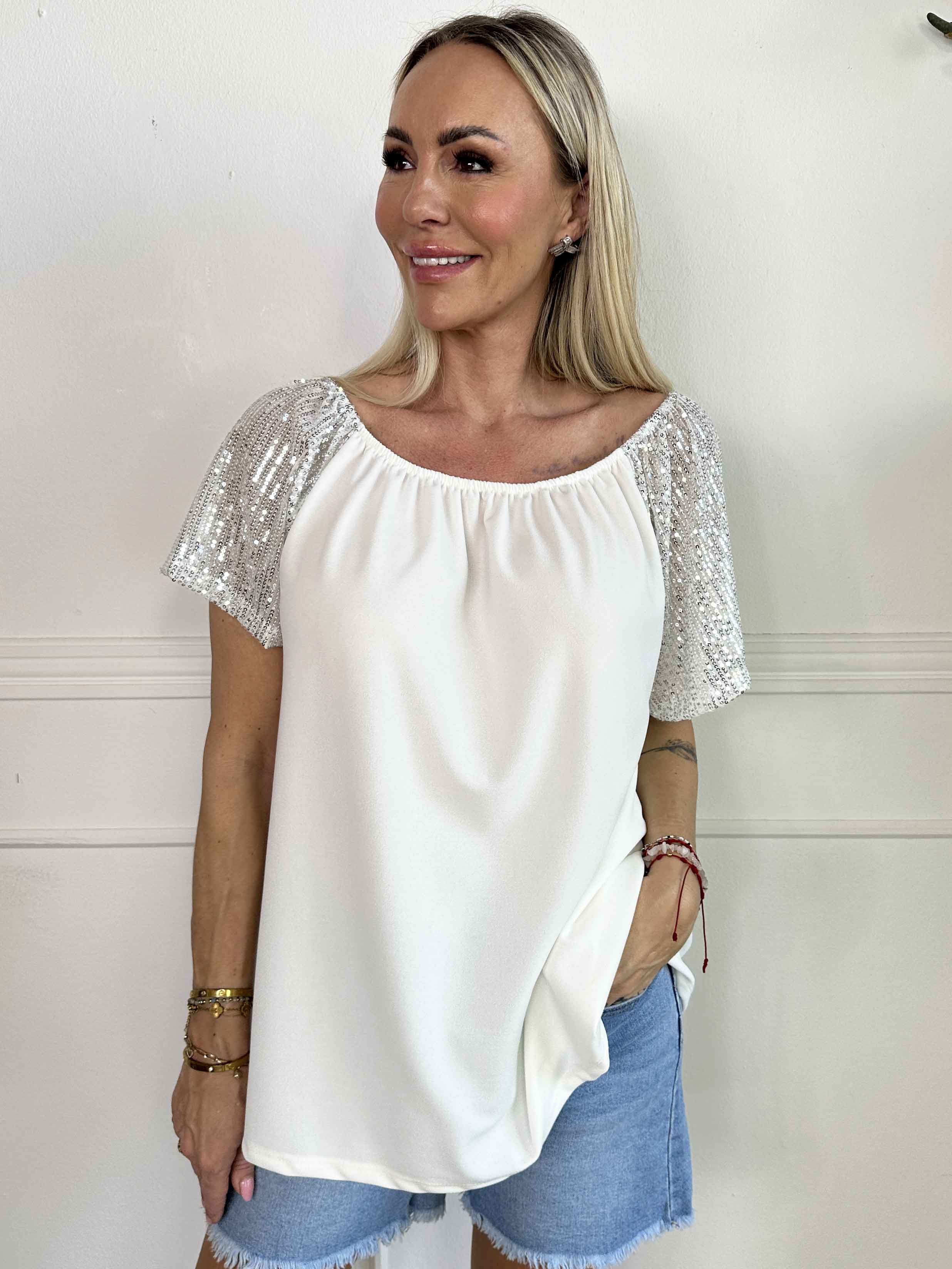 Kim Shirt - Söt och feminin blus med resår och ärmar med glittriga paljetter