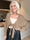 Odette - Kort og feminin strikcardigan, der lukkes med en fin sløjfe ved brystet