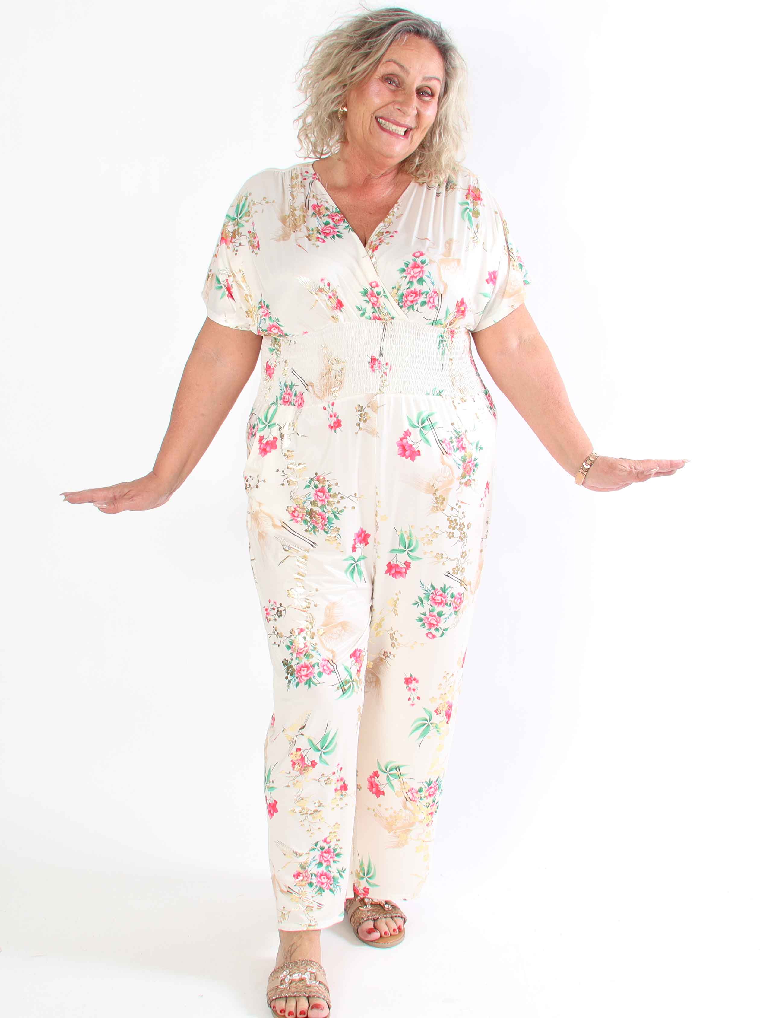 Pams Fly Jumpsuit - Elastisk plus size byxdress med blommor- och fåglemönster
