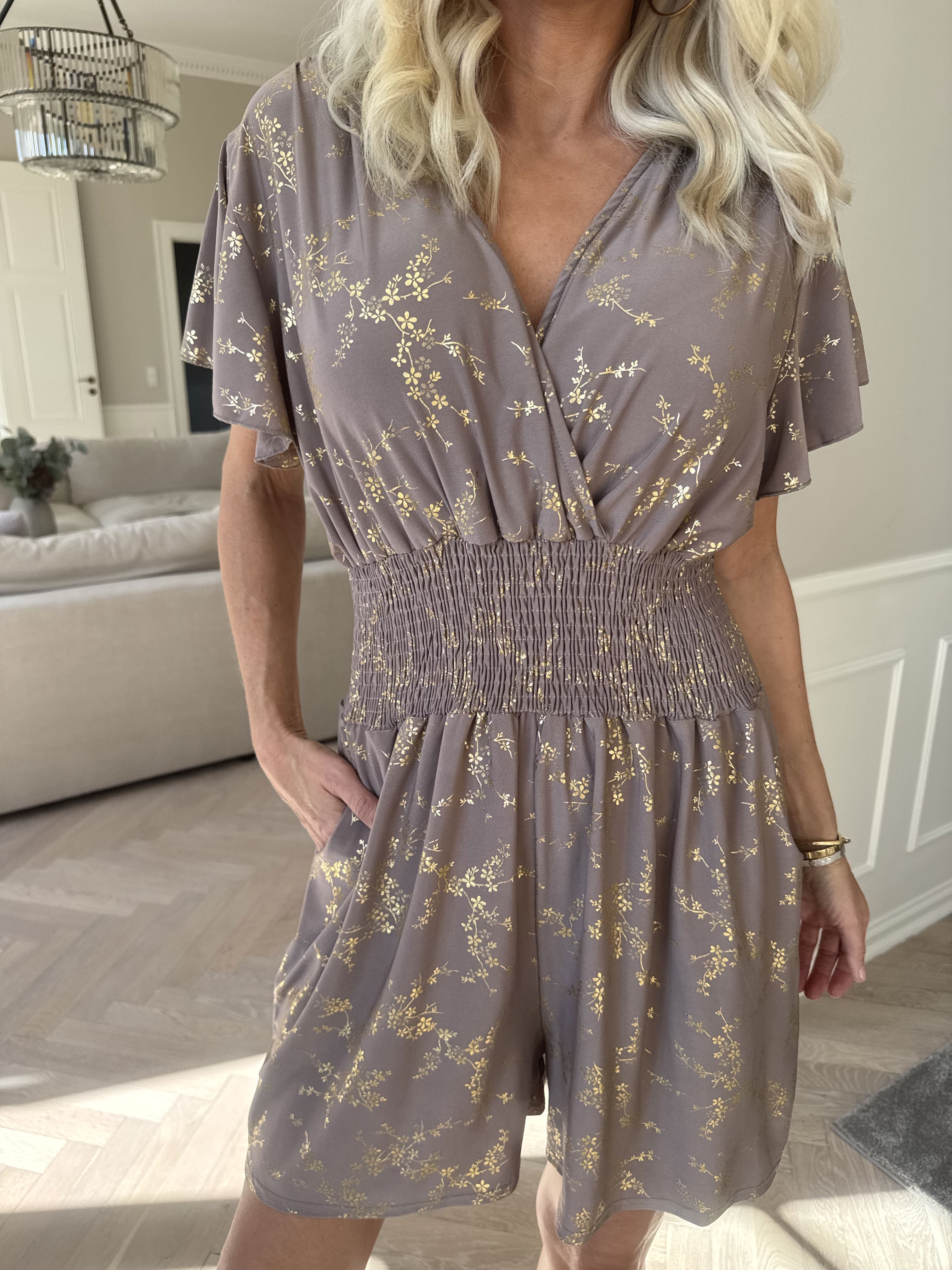 Pams Gold Playsuit - Jumpsuit med resår och guldtryck