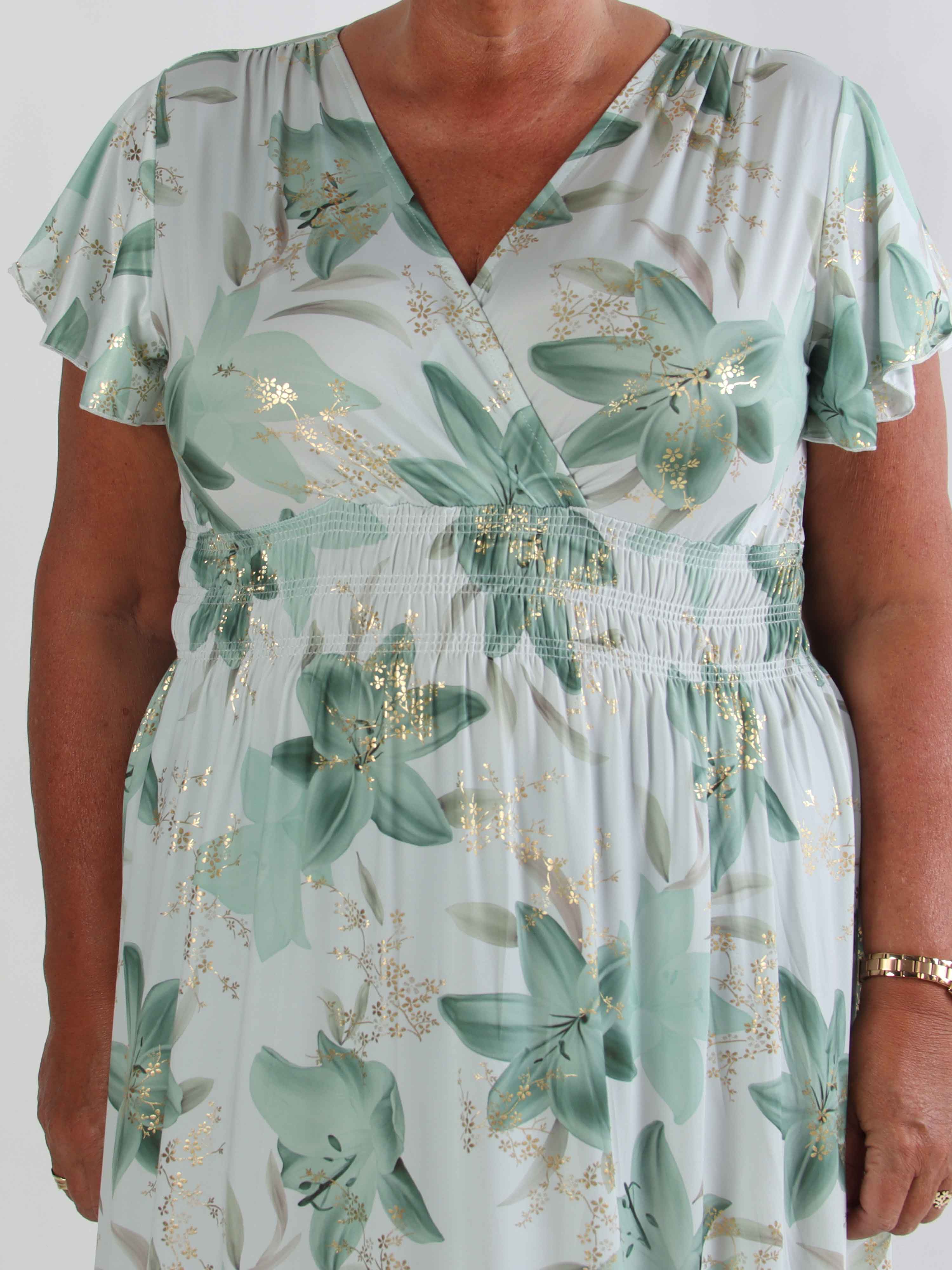 Pams Lilies - Elastisk plus size klänning med liljemönster och gulddetaljer