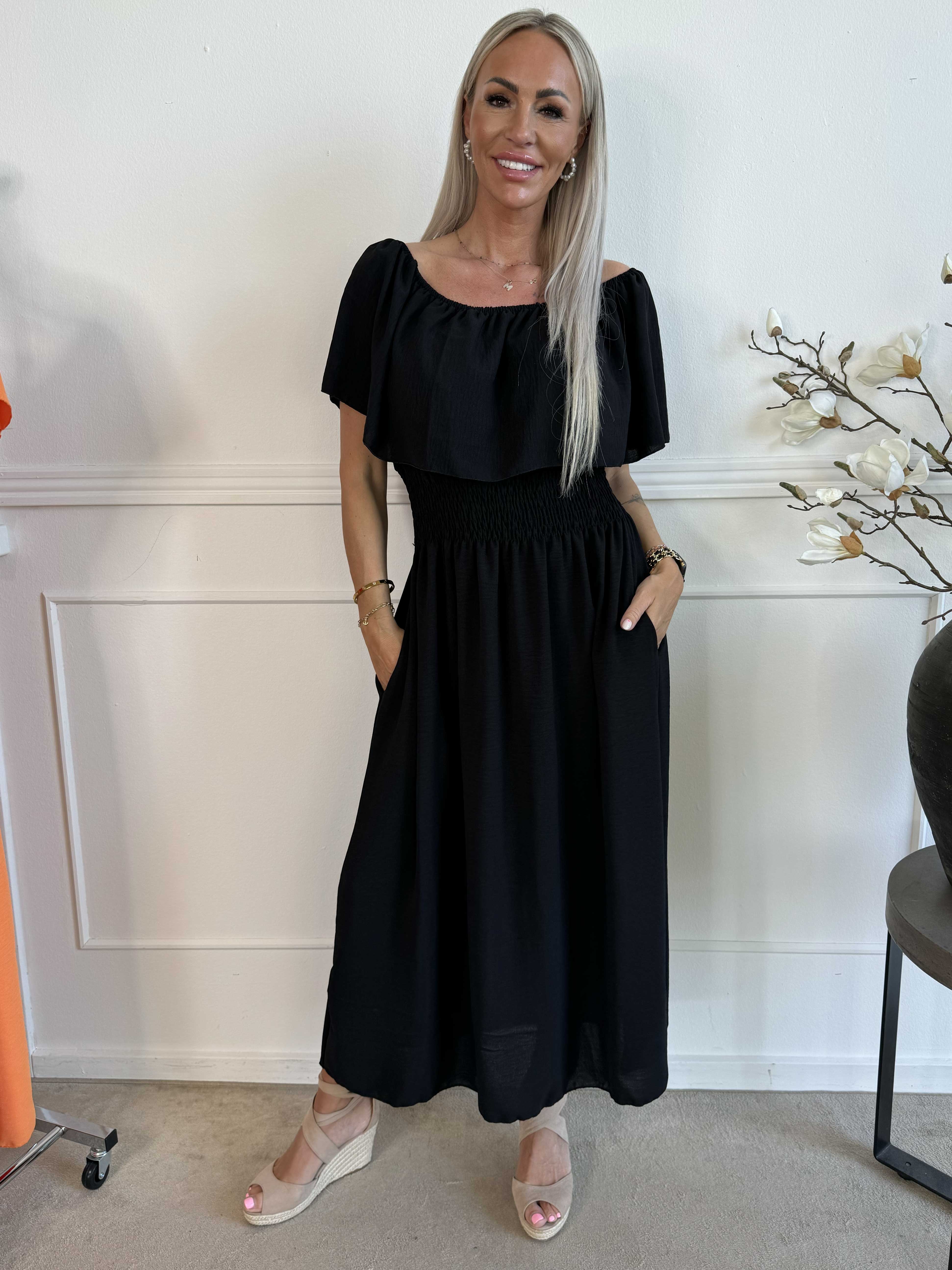 Rachel - Lång klänning med fickor och volang i nederkanten