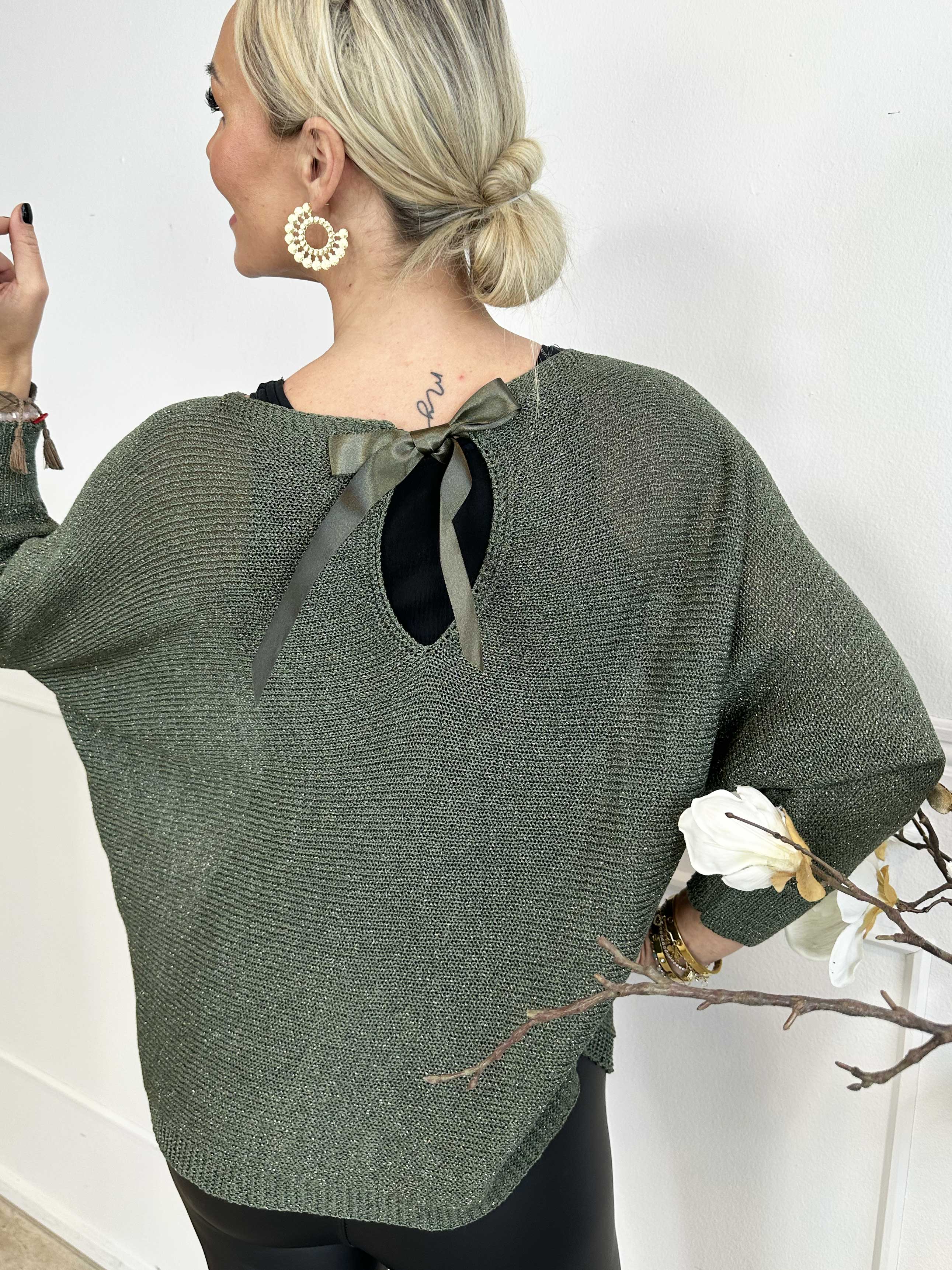 Paulina - Stickad blus med glittertrådar och rosett