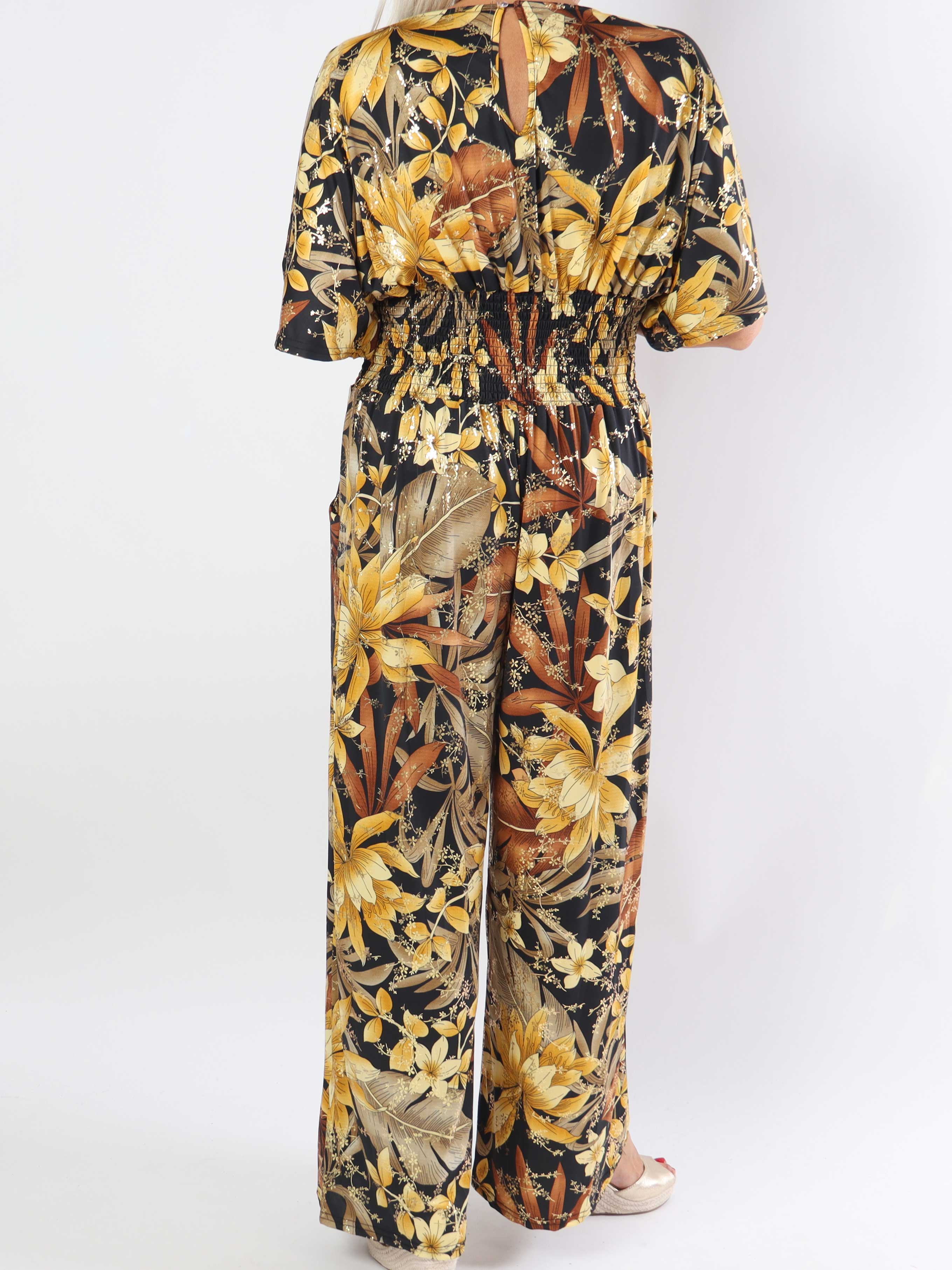 Pams Jumpsuit - Elastisk jumpsuit i plusstorlek med bladmönster