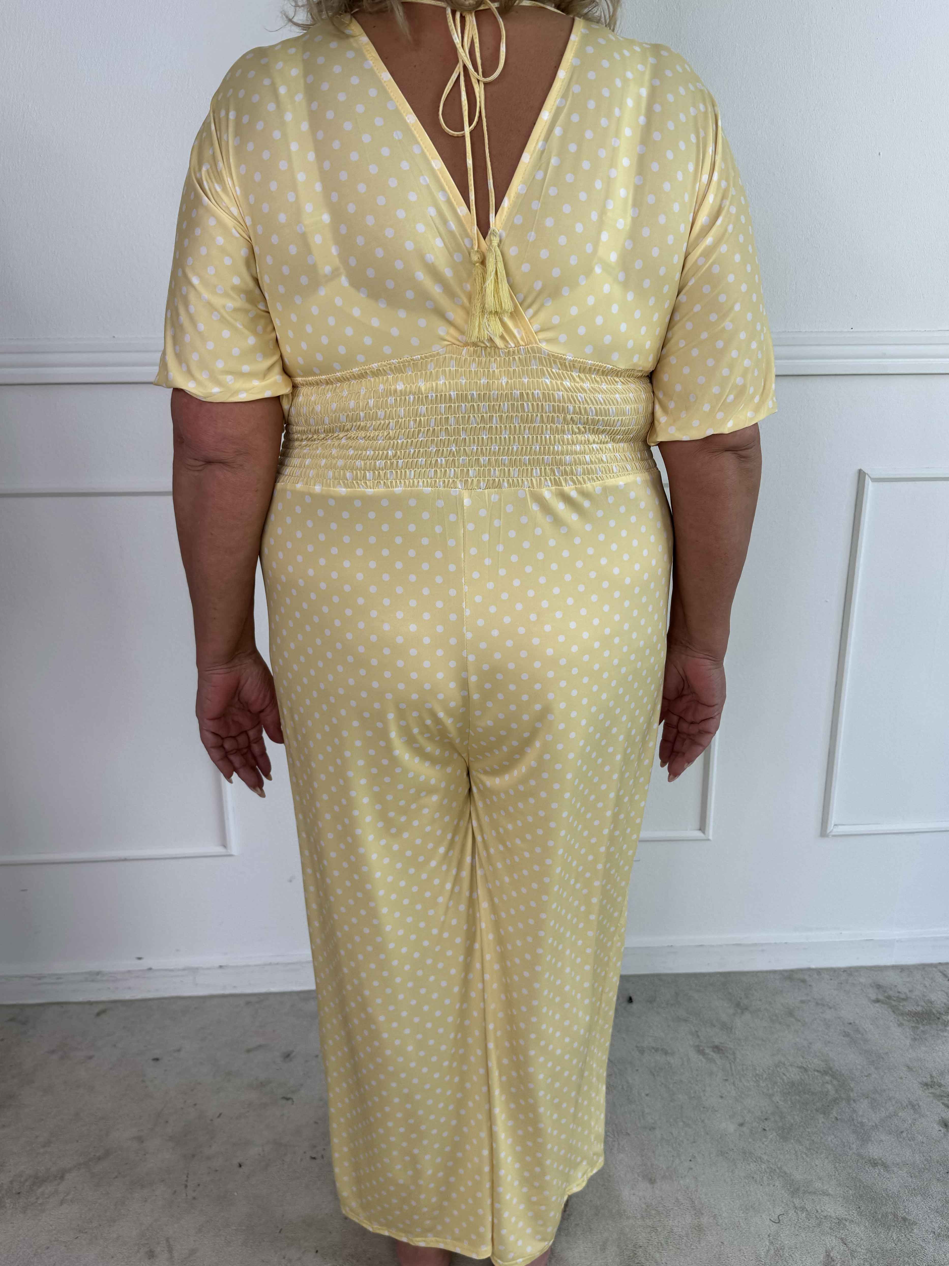Grace - Stretchig plus size jumpsuit med vita prickar