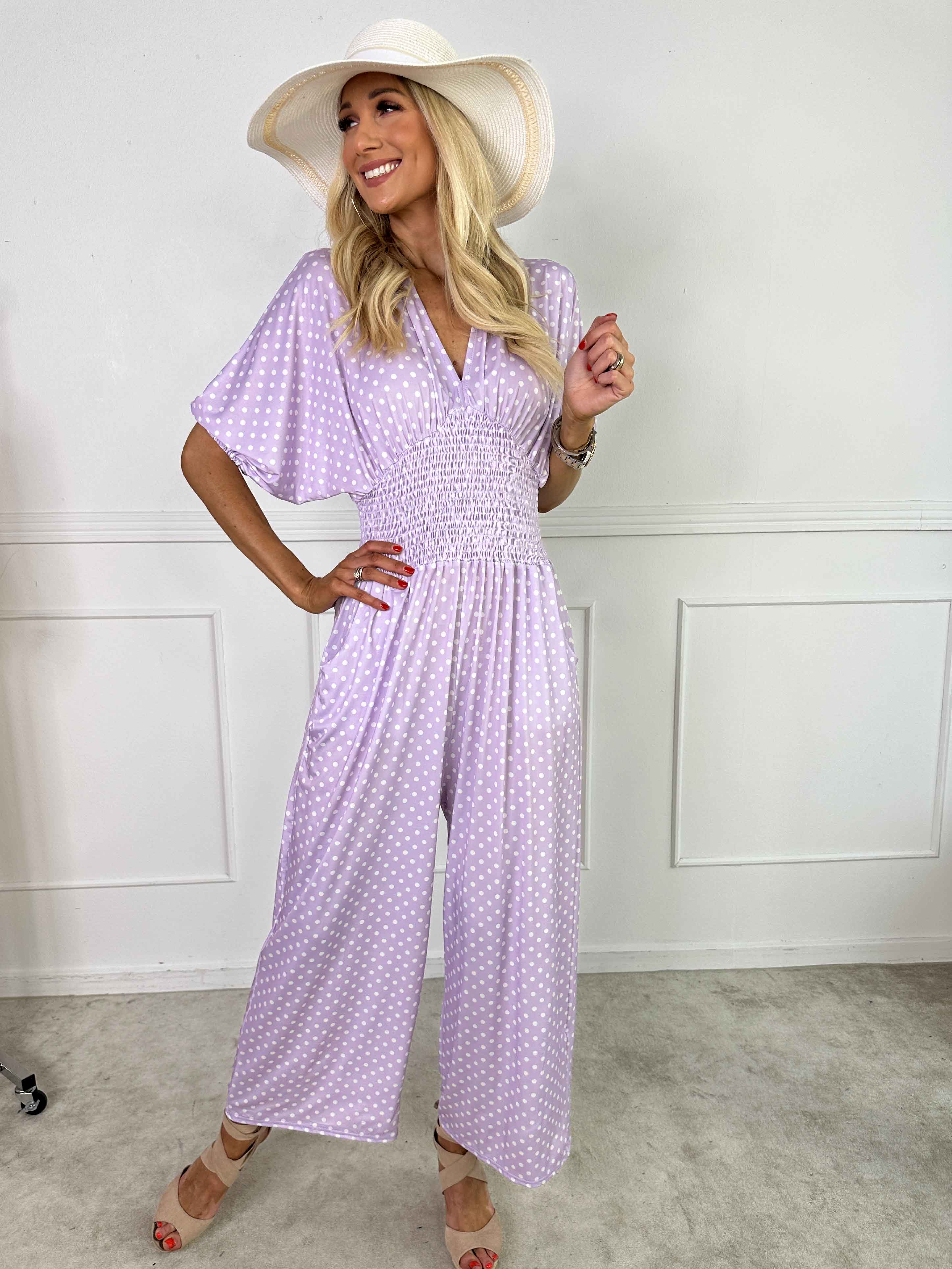 Grace - Stretchig jumpsuit med vita prickar