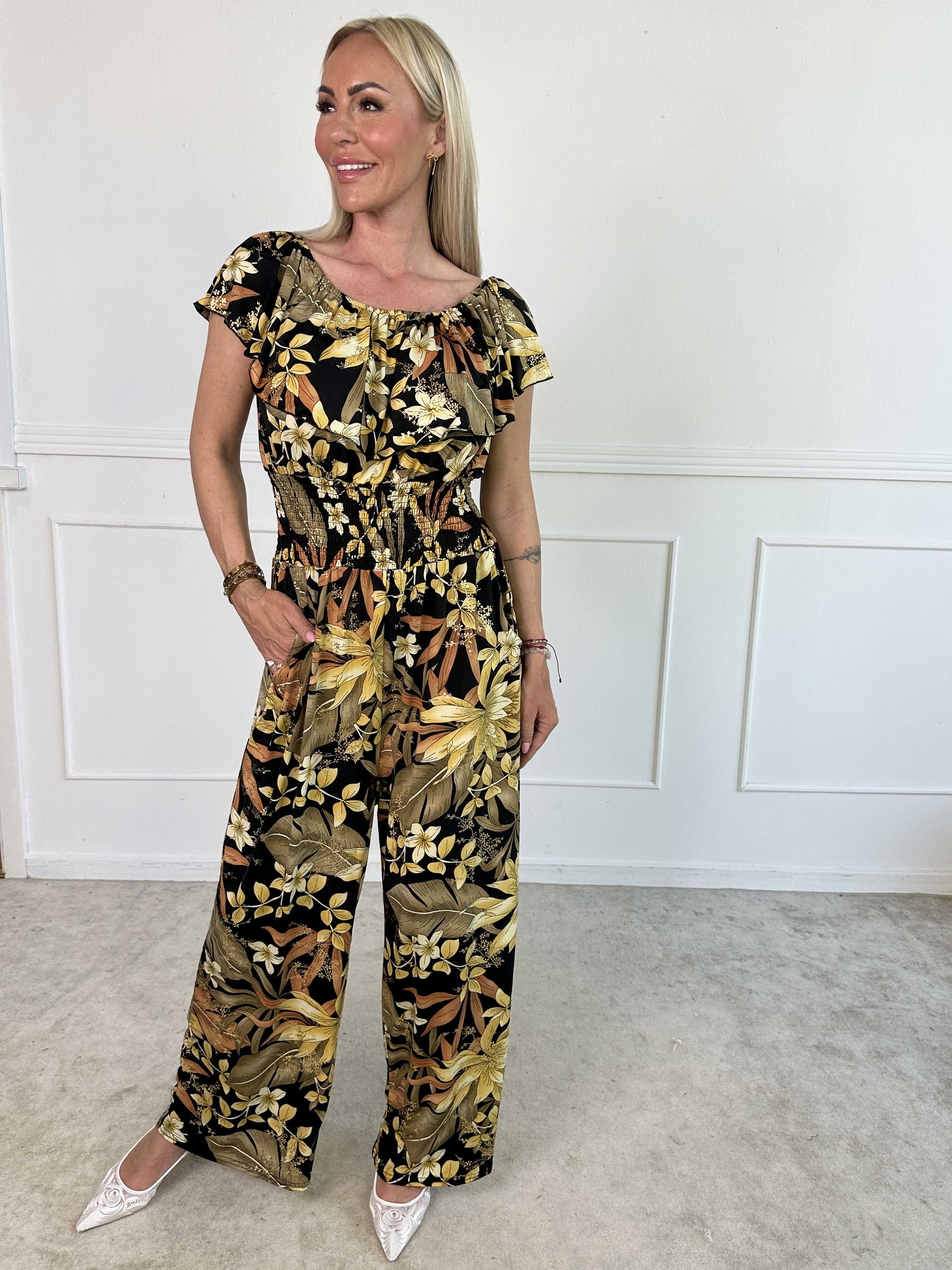 Pams Frill Jumpsuit - Elastisk jumpsuit med smock och volang