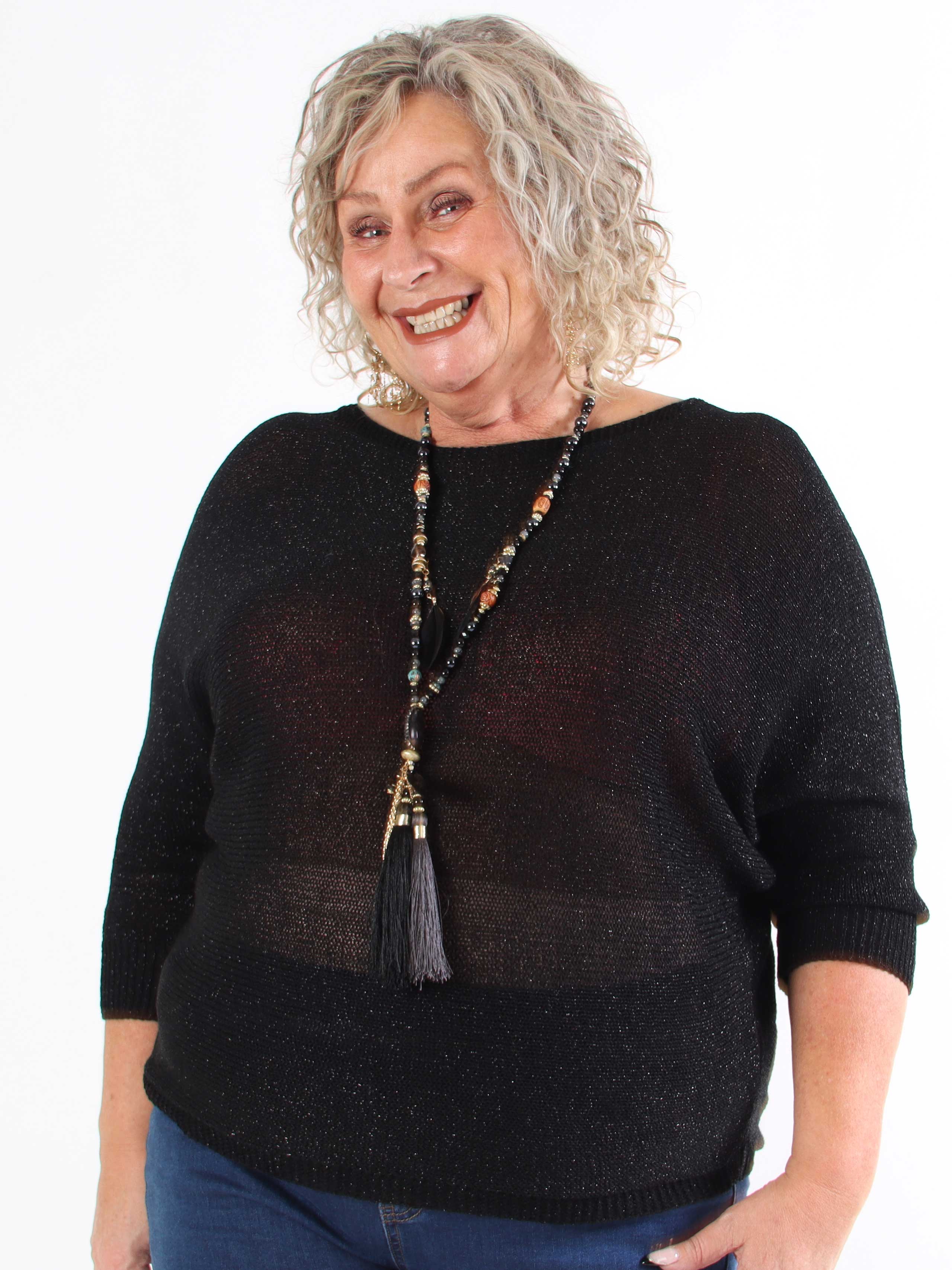 Paulina - Stickad blus i plus size med glittertrådar och rosett