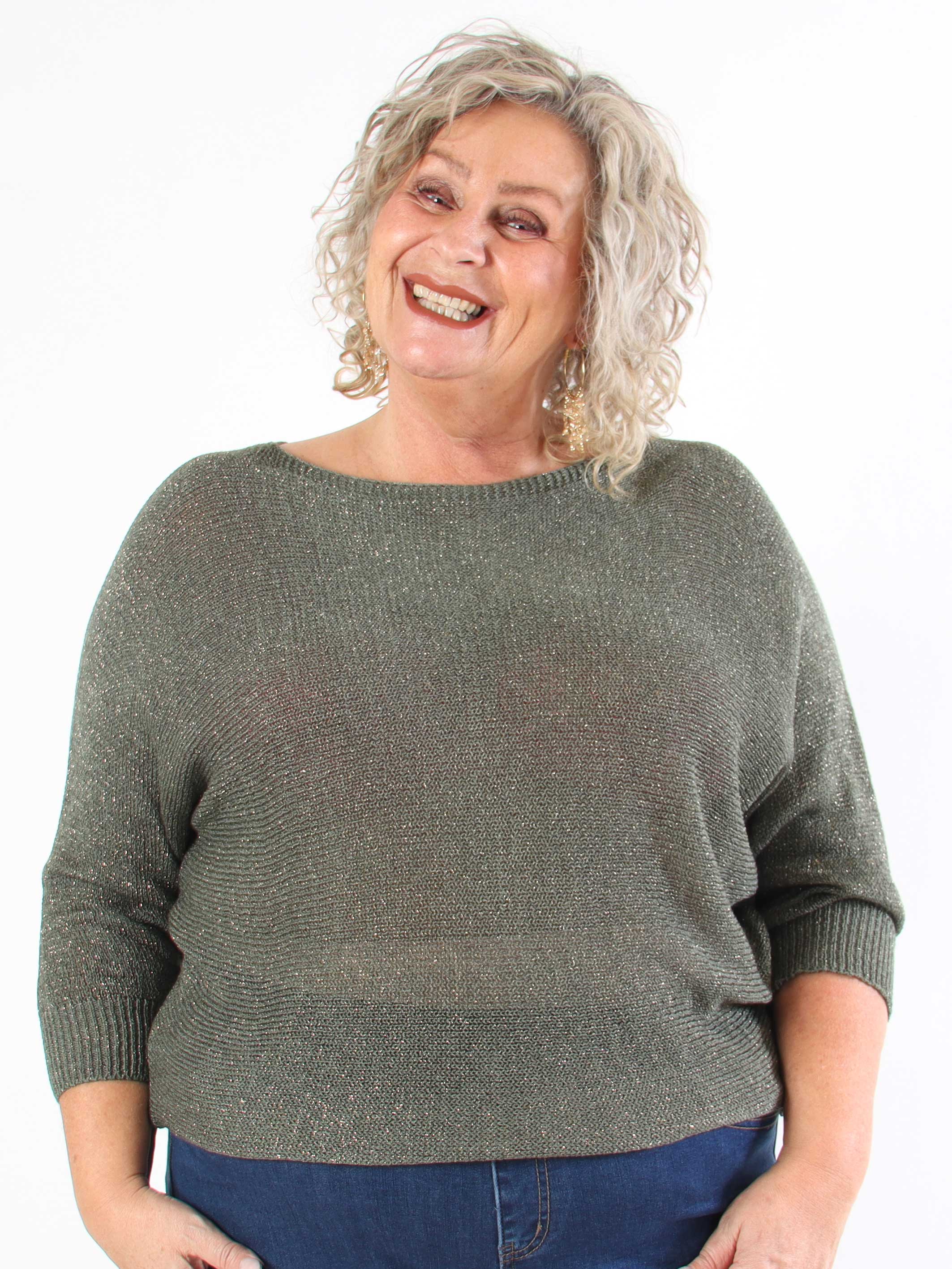 Paulina - Stickad blus i plus size med glittertrådar och rosett
