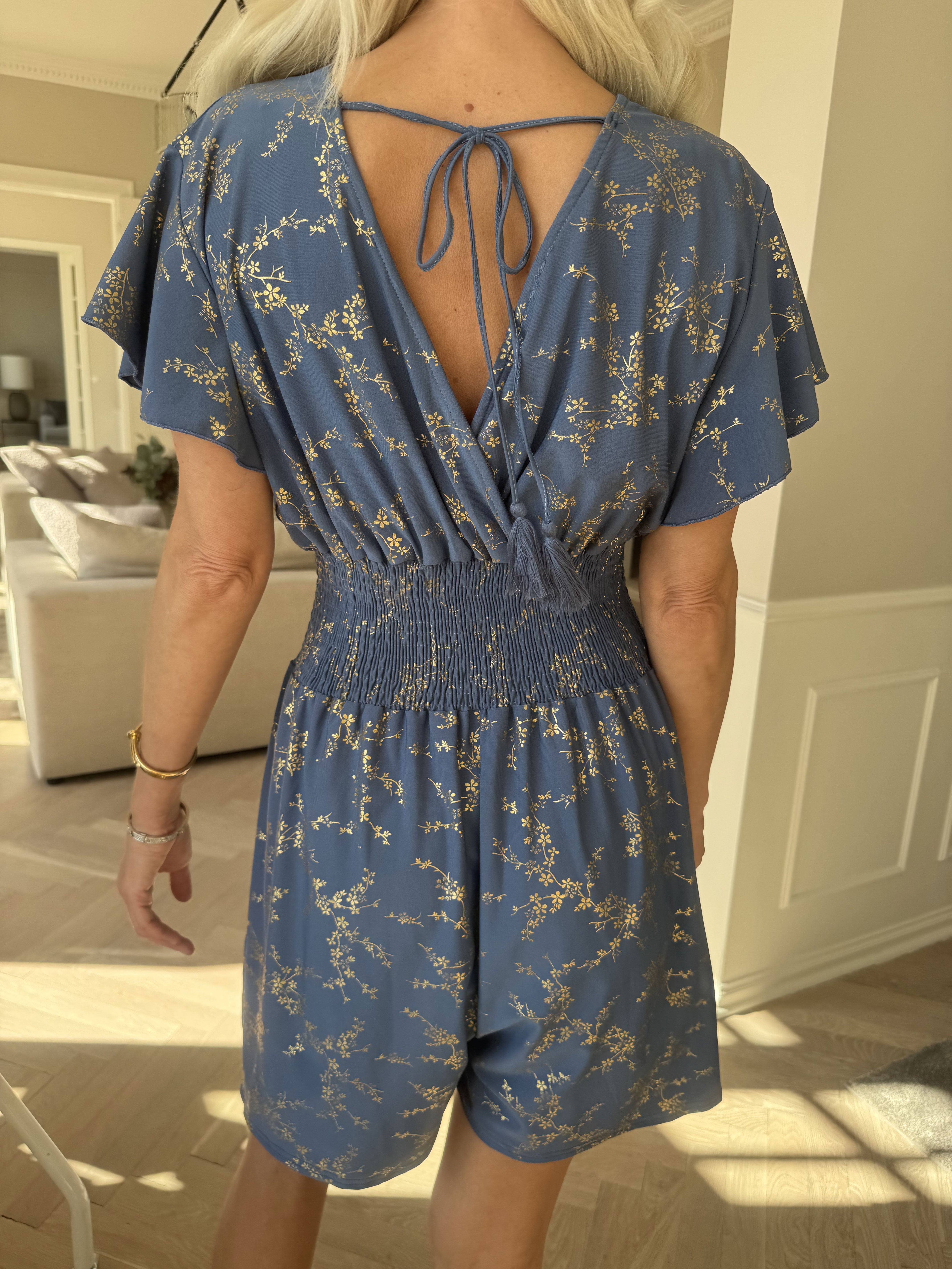 Pams Gold Playsuit - Jumpsuit med resår och guldtryck