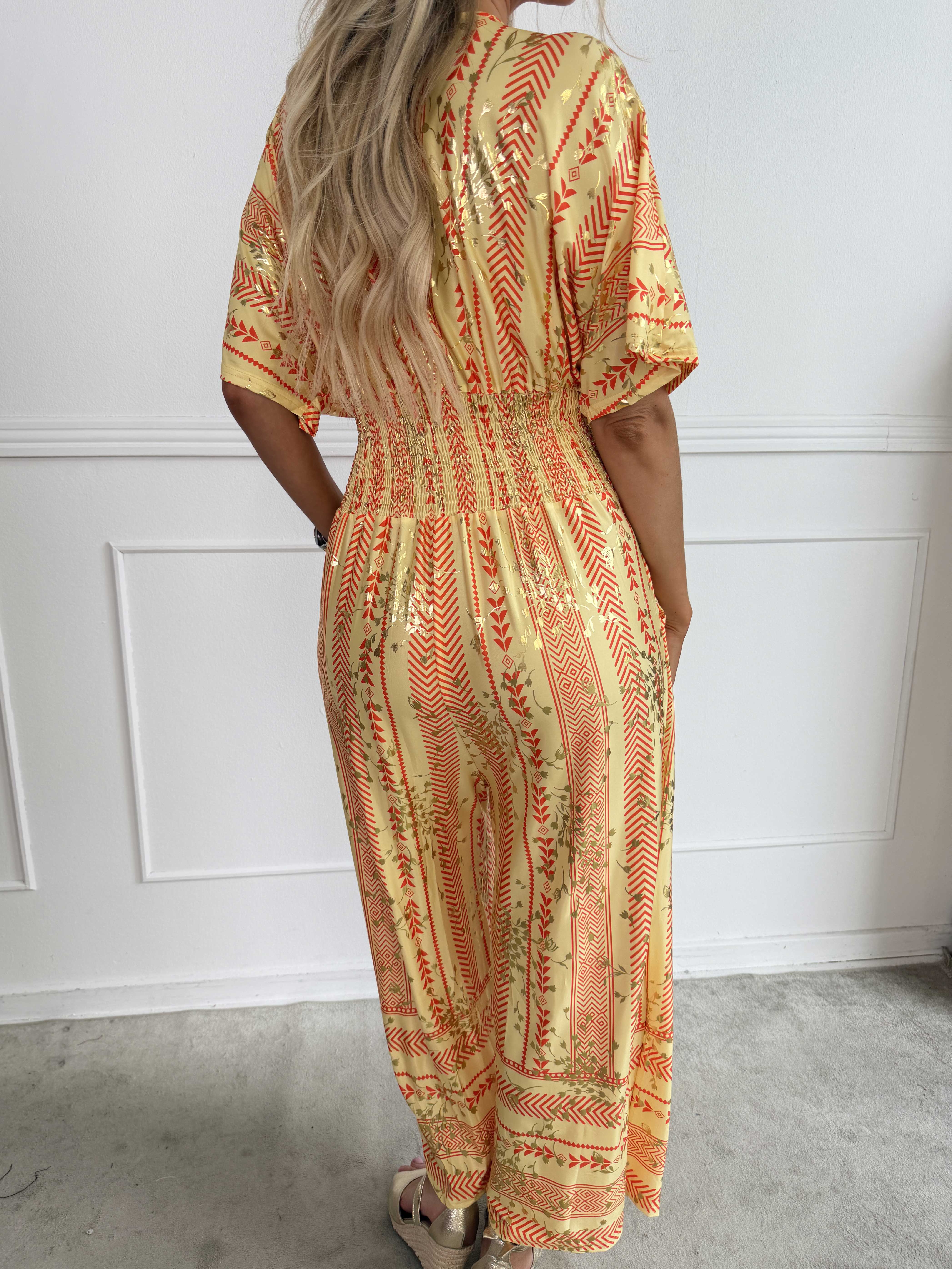 Pams Tribal Jumpsuit - Elastisk mønstret buksedragt med små guld blomster