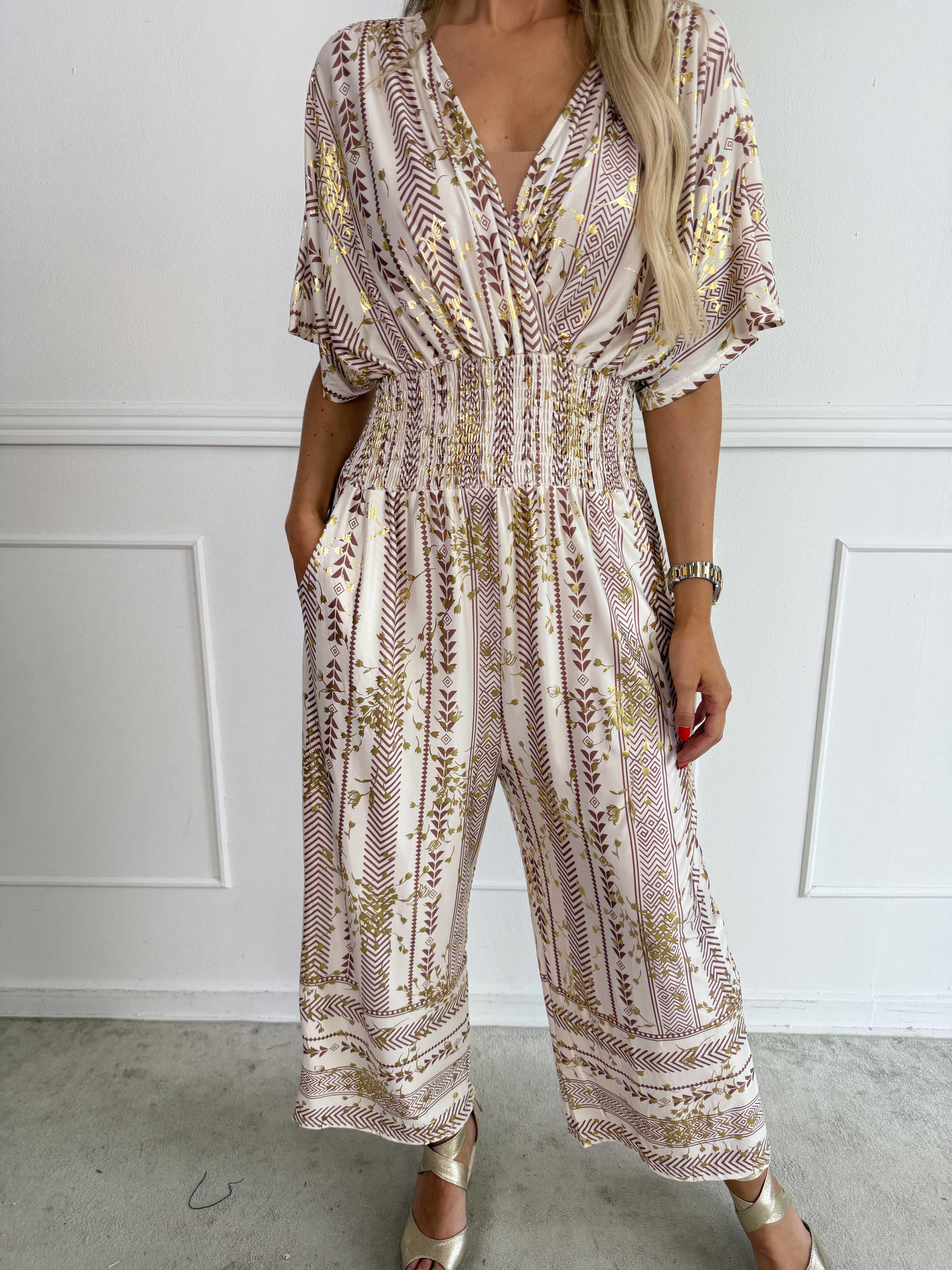 Pams Tribal Jumpsuit - Elastisk mønstret buksedragt med små guld blomster