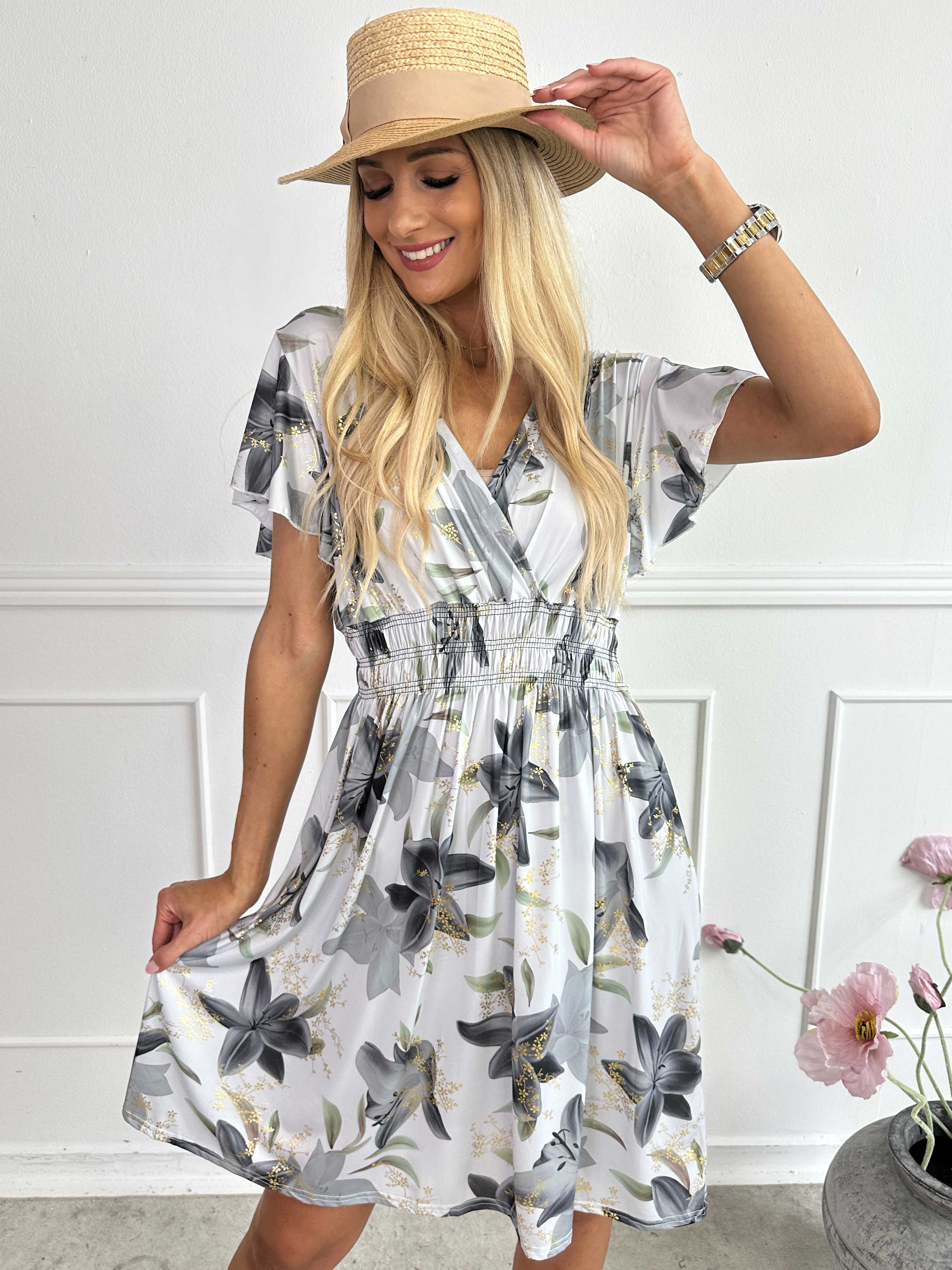 Pams Lilies Short - Kort elastisk klänning med liljemönster och gulddetaljer
